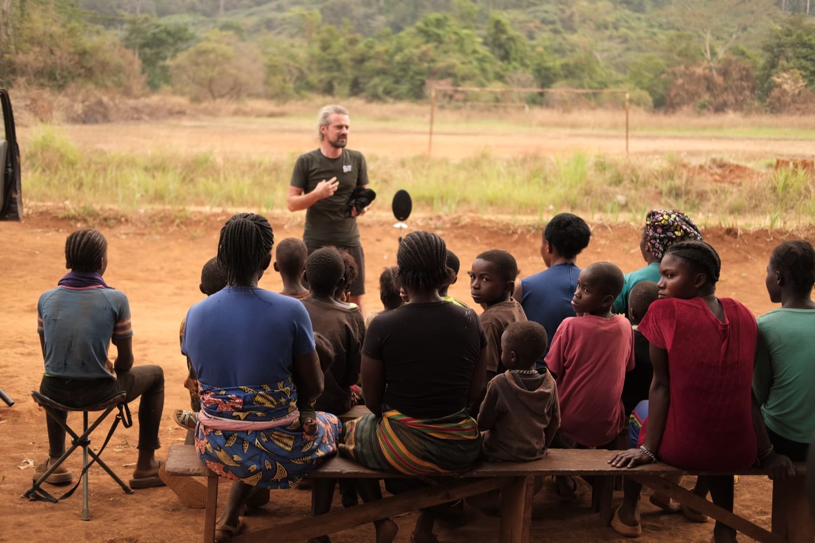 Axel Drioli sharing field recordings with a village audience in West Africa